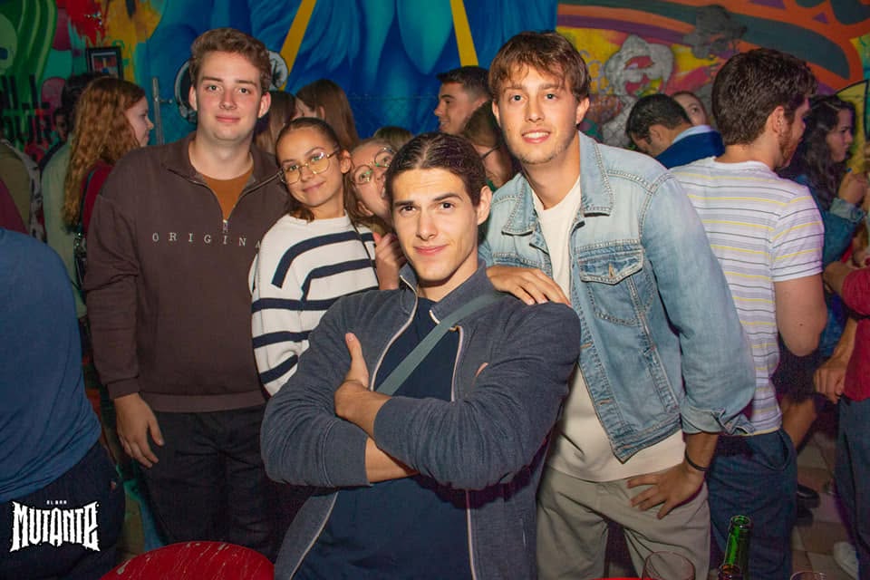 Friends meeting in a vibrant bar